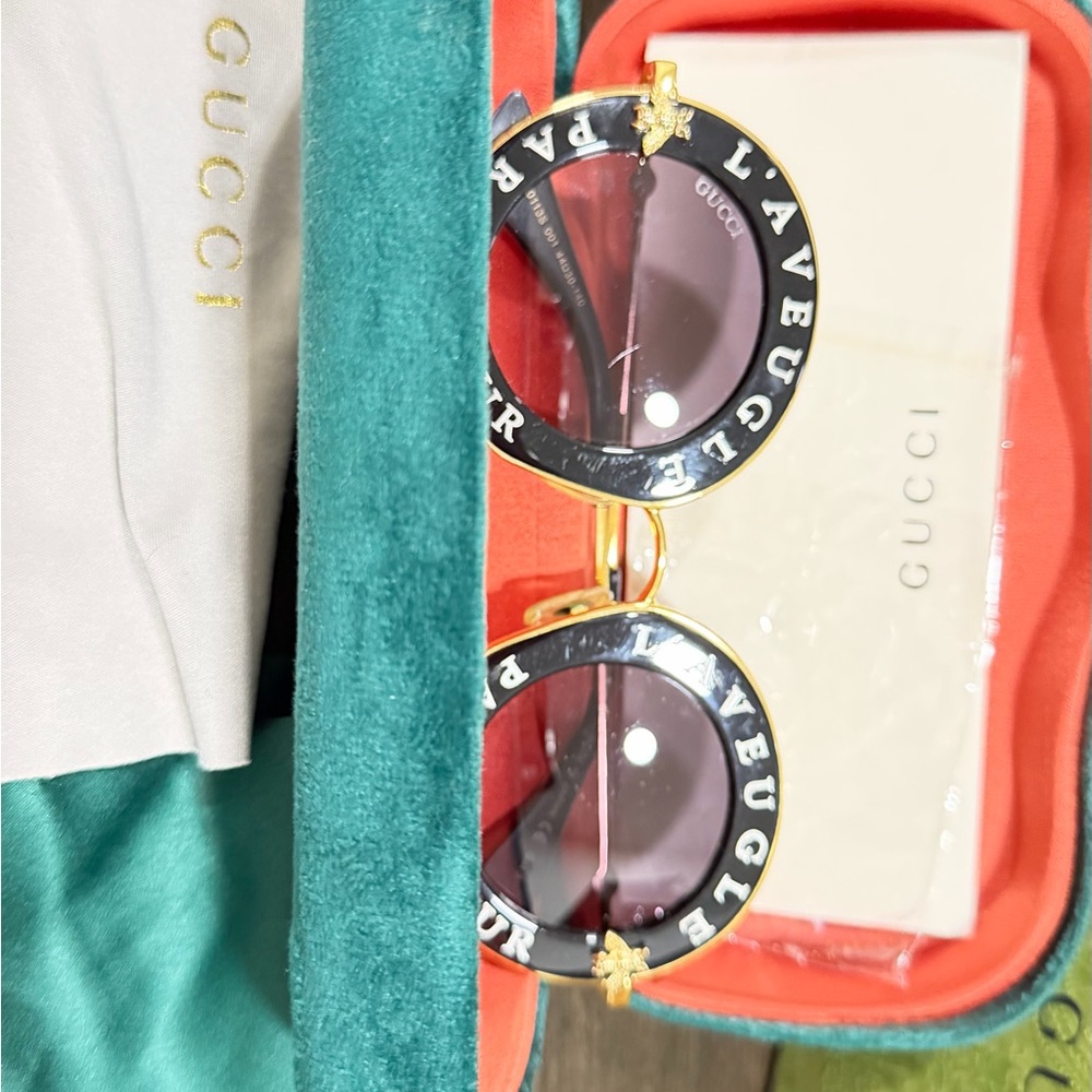 Gucci Women's Black and Gold Round Sunglasses